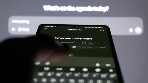 Person typing on a smartphone with an AI chat assistant on screen