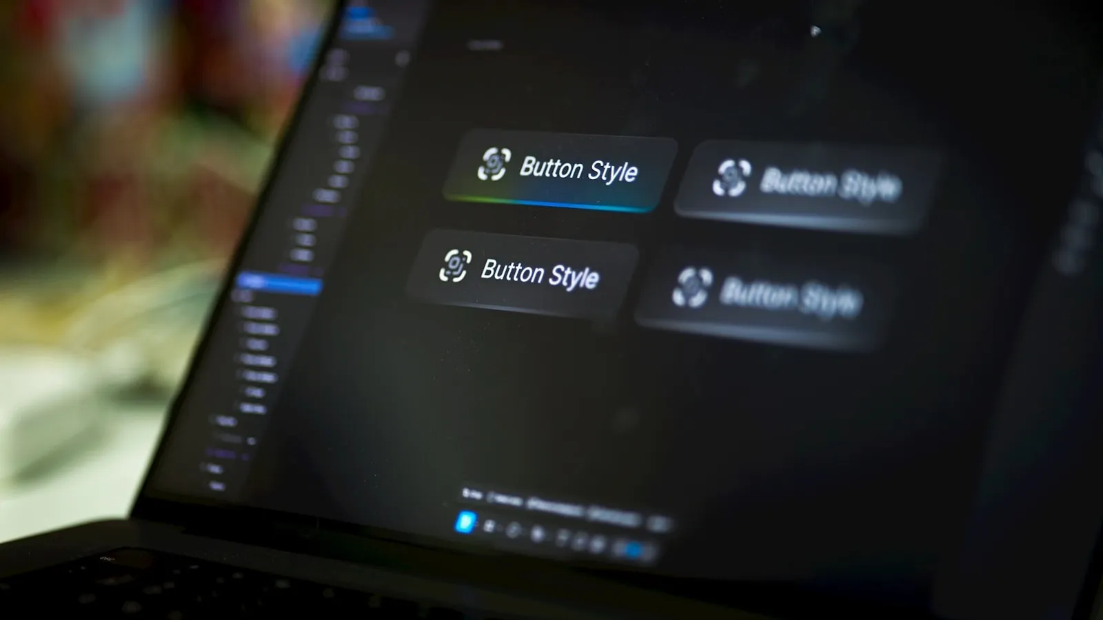 Laptop screen displaying user-interface button styles in a design tool