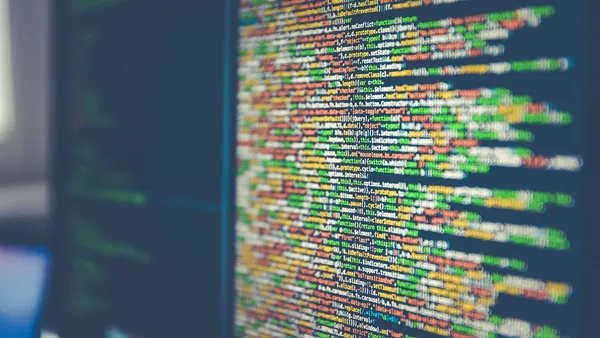 Colorful software code displayed on a computer monitor