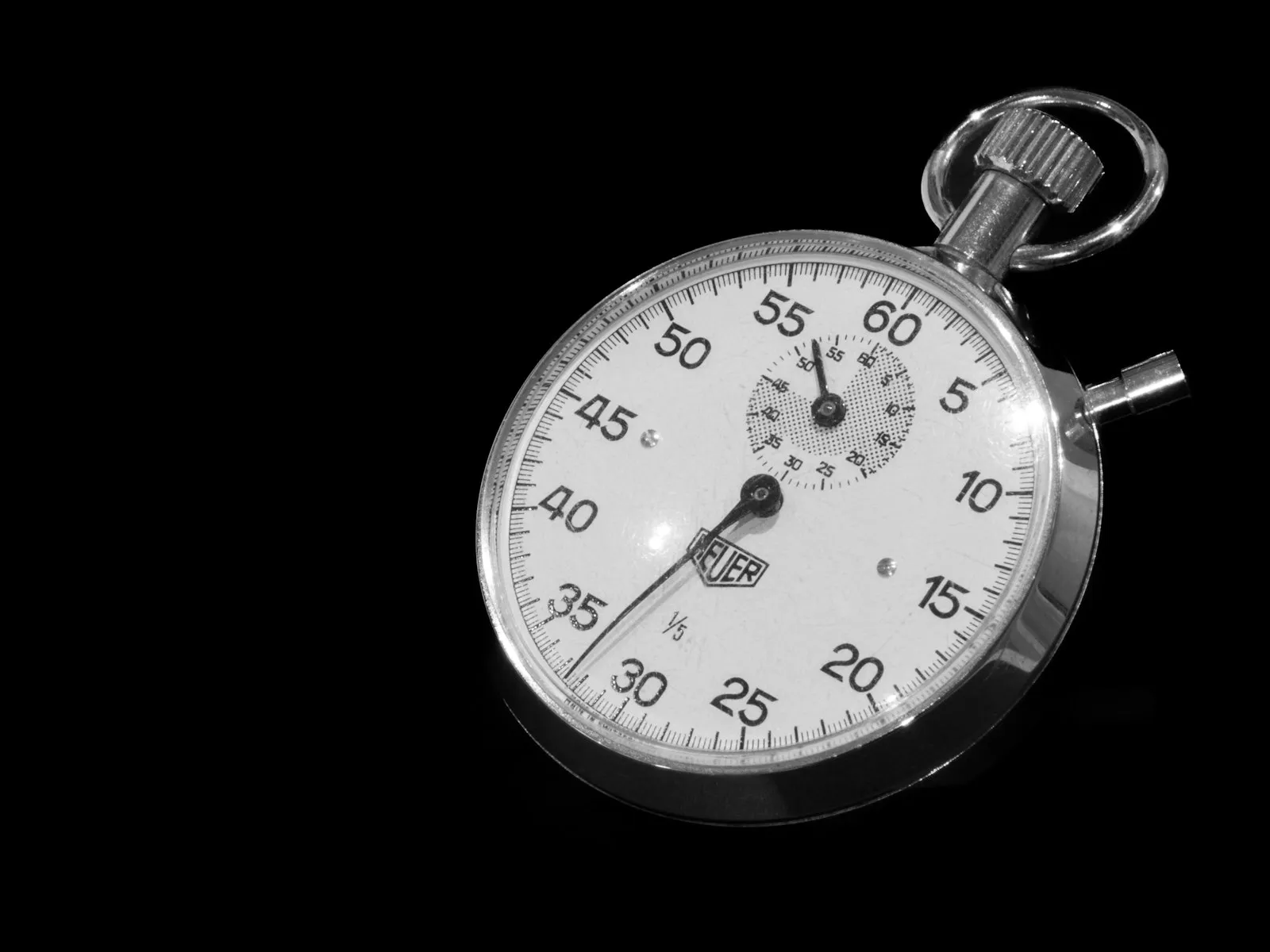 Close-up of a stopwatch on a dark background