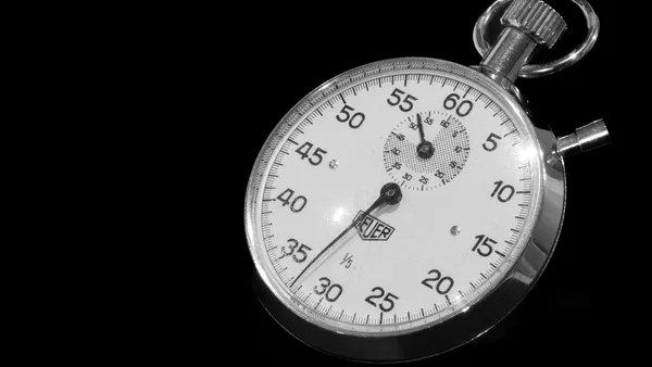 Close-up of a stopwatch on a dark background