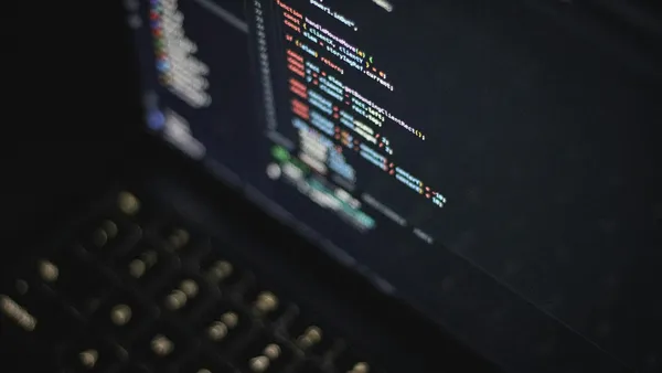 Computer screen displaying colorful lines of programming code