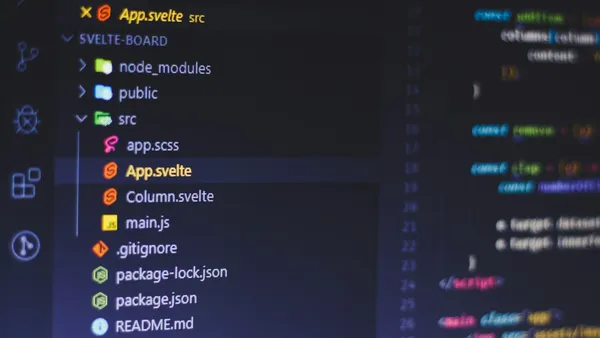 Computer monitor displaying a code editor interface