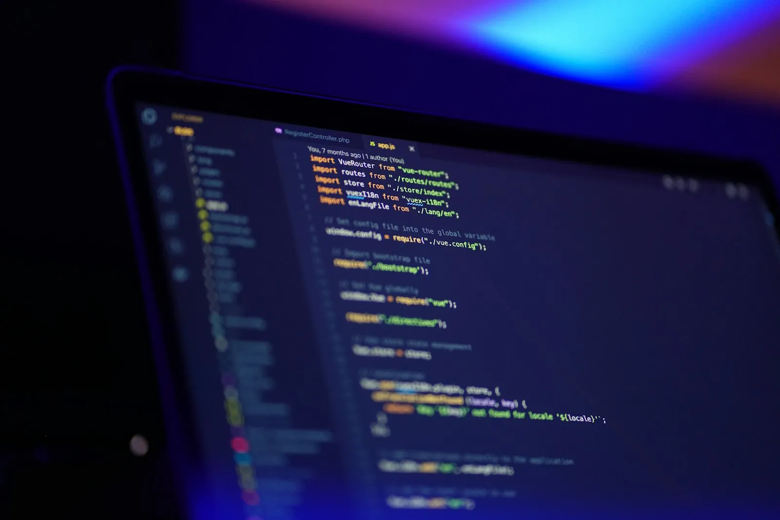 Laptop screen displaying colorful lines of code